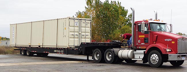 Transport carrying The Scarlet Cord container to NCMC