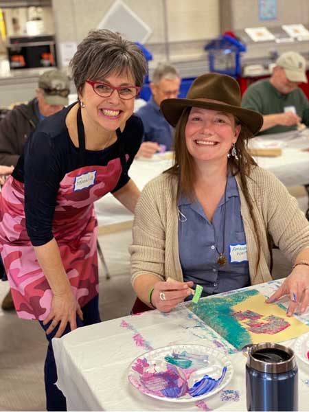 Veterans and families during workshops creating art for Yellow Ribbon installation