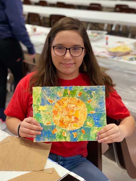 Veterans and families during workshops creating art for Yellow Ribbon installation